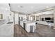 Bright, open kitchen features white cabinets, stainless appliances, and a large marble island, perfect for entertaining at 10062 Mountain Foothills Ave, Las Vegas, NV 89149