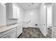Well-lit laundry room offers ample counter space, modern cabinetry, and a sink for added convenience at 10062 Mountain Foothills Ave, Las Vegas, NV 89149