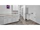Convenient laundry room featuring modern white cabinets and folding counter at 10062 Mountain Foothills Ave, Las Vegas, NV 89149