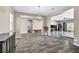 Spacious living room featuring wood-look tile floors and an open floor plan at 10062 Mountain Foothills Ave, Las Vegas, NV 89149