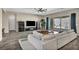 A living room features a fireplace, dark entertainment center, and glass doors with views of the pool area at 10062 Mountain Foothills Ave, Las Vegas, NV 89149