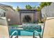 Relaxing view of the pool area with a built-in jacuzzi and outdoor seating at 10062 Mountain Foothills Ave, Las Vegas, NV 89149