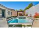 Tranquil backyard swimming pool and spa with lounge chairs, ideal for relaxation at 10062 Mountain Foothills Ave, Las Vegas, NV 89149