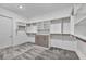 Large walk-in closet with built-in shelving and gray carpeting, providing ample storage space at 10062 Mountain Foothills Ave, Las Vegas, NV 89149