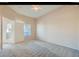 Neutral-toned bedroom with carpet flooring, a ceiling fan, and a window for natural light at 10245 S Maryland Pkwy # 255, Las Vegas, NV 89183