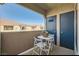 Cozy outdoor patio with table and chairs, perfect for enjoying the fresh air and views at 10245 S Maryland Pkwy # 255, Las Vegas, NV 89183