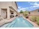 Stunning backyard features a pool, jacuzzi, covered patio, and serene outdoor living space at 10368 Pima Crossing Ave, Las Vegas, NV 89166