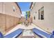 Outdoor patio with lounge chairs and table, perfect for relaxing and entertaining at 10368 Pima Crossing Ave, Las Vegas, NV 89166