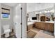 Bright bathroom featuring a double vanity, a soaking tub, and tile floors at 10368 Pima Crossing Ave, Las Vegas, NV 89166