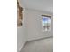 Neutral bedroom featuring a framed art piece and a window letting in natural light at 10368 Pima Crossing Ave, Las Vegas, NV 89166