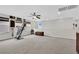 Generously sized bonus room with lots of natural light, carpeted floors and ceiling fan at 10368 Pima Crossing Ave, Las Vegas, NV 89166