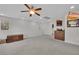 Carpeted bonus room with plenty of space, natural light, and ceiling fan at 10368 Pima Crossing Ave, Las Vegas, NV 89166