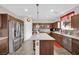 Well-lit kitchen featuring stainless steel appliances, plenty of cabinet space, and a central island at 10368 Pima Crossing Ave, Las Vegas, NV 89166