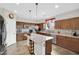 Bright kitchen with stainless steel appliances, a kitchen island and tile backsplash at 10368 Pima Crossing Ave, Las Vegas, NV 89166