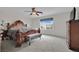 Serene bedroom with window, ceiling fan, plush carpeting, and an ornate headboard at 10368 Pima Crossing Ave, Las Vegas, NV 89166