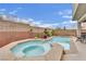 Inviting backyard pool and spa, perfect for relaxation and entertaining with beautiful plants and flowers at 10368 Pima Crossing Ave, Las Vegas, NV 89166