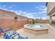 Beautiful pool and spa combination with a calming patio area, ideal for outdoor living and entertaining with beautiful flowers at 10368 Pima Crossing Ave, Las Vegas, NV 89166