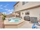 A backyard with an inviting pool and spa, offering a private oasis for relaxation and fun with an outdoor grill at 10368 Pima Crossing Ave, Las Vegas, NV 89166