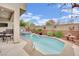 Relaxing backyard pool area with a jacuzzi and covered patio seating space at 10368 Pima Crossing Ave, Las Vegas, NV 89166