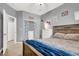 Bedroom with a queen bed, dresser, window, and decorative accents on the wall at 10783 Vestone St, Las Vegas, NV 89141