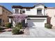 Charming two-story home featuring a manicured front yard and a two-car garage at 10783 Vestone St, Las Vegas, NV 89141