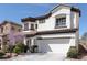 Charming two-story home featuring a manicured front yard and a two-car garage at 10783 Vestone St, Las Vegas, NV 89141