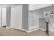 Hallway area with a double-door closet, railing, and stairs leading to another level at 10783 Vestone St, Las Vegas, NV 89141
