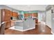 Spacious kitchen featuring a large island, modern appliances, and hardwood floors at 10783 Vestone St, Las Vegas, NV 89141