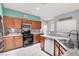 Stylish kitchen featuring granite countertops, stainless steel appliances, and ample cabinet space at 10783 Vestone St, Las Vegas, NV 89141