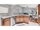 Open kitchen with granite countertops, stainless steel appliances, and a dining area at 10783 Vestone St, Las Vegas, NV 89141