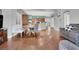 Spacious living room with hardwood floors, open floor plan, and updated fixtures at 10783 Vestone St, Las Vegas, NV 89141