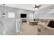 Bright upstairs living room with plush seating, a ceiling fan, and ample natural light at 10783 Vestone St, Las Vegas, NV 89141