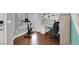 Home office area is equipped with desk, chair, exercise bike, and plenty of natural light at 10783 Vestone St, Las Vegas, NV 89141