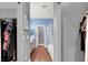 Long walk-in closet with shelving and rod hanging space, located next to en suite bathroom at 10783 Vestone St, Las Vegas, NV 89141