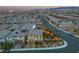 Aerial view showcasing a home with solar panels, landscaped yard, and outdoor living space at 10988 Wonder Hills St, Las Vegas, NV 89141