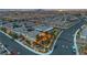 Aerial view of homes with a beautiful backyard with lighting, gazebo, and modern landscaping at 10988 Wonder Hills St, Las Vegas, NV 89141