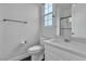 Bright bathroom featuring black hexagon tile flooring and a vanity at 10988 Wonder Hills St, Las Vegas, NV 89141