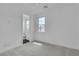Bright bedroom featuring neutral carpet and a window offering outdoor views at 10988 Wonder Hills St, Las Vegas, NV 89141