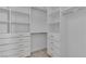 Bright walk-in closet with modern organizers including drawers, shelves, and hanging space at 10988 Wonder Hills St, Las Vegas, NV 89141