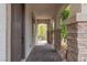 Charming front porch with stone columns and a brick walkway leading to the entrance at 10988 Wonder Hills St, Las Vegas, NV 89141