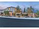 Inviting two-story home boasts illuminated landscaping and an ornate fountain feature at 10988 Wonder Hills St, Las Vegas, NV 89141