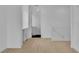 Hallway features a built-in desk, white trim, and access to rooms for seamless living at 10988 Wonder Hills St, Las Vegas, NV 89141
