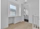 Hallway features a built-in desk, window, and access to rooms for seamless living at 10988 Wonder Hills St, Las Vegas, NV 89141