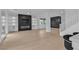 Spacious living room with fireplace, built-ins, and abundant natural light at 10988 Wonder Hills St, Las Vegas, NV 89141