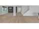 A large open-concept living room showcasing hardwood floors, natural light, and a modern aesthetic at 10988 Wonder Hills St, Las Vegas, NV 89141