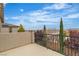 View from textured patio overlooking neighborhood rooftops at 10988 Wonder Hills St, Las Vegas, NV 89141