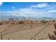 Rooftop view featuring tile roofs, city skyline and mountain views in the distance at 10988 Wonder Hills St, Las Vegas, NV 89141