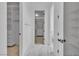Walk in closet with marble floor and custom storage at 10988 Wonder Hills St, Las Vegas, NV 89141