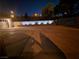 A large, illuminated driveway at night at 1163 Spanish Armada Rd, Las Vegas, NV 89123
