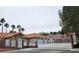 Charming single-story home featuring a terra cotta roof, desert landscaping and gated entry way at 1163 Spanish Armada Rd, Las Vegas, NV 89123